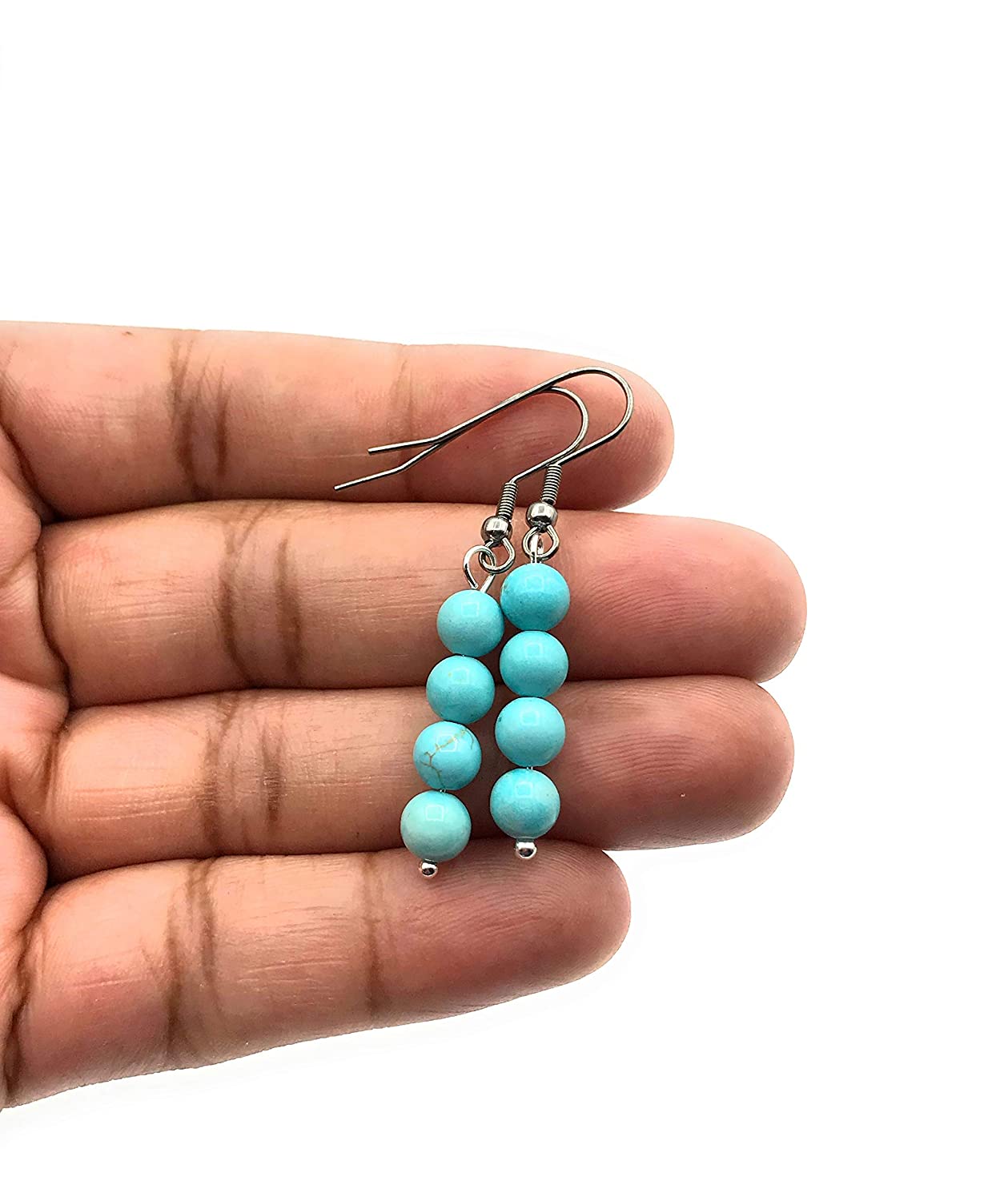 Blue Magnesite Gemstone Dangle Beaded Earrings on a Hand from Scott D Jewelry Designs