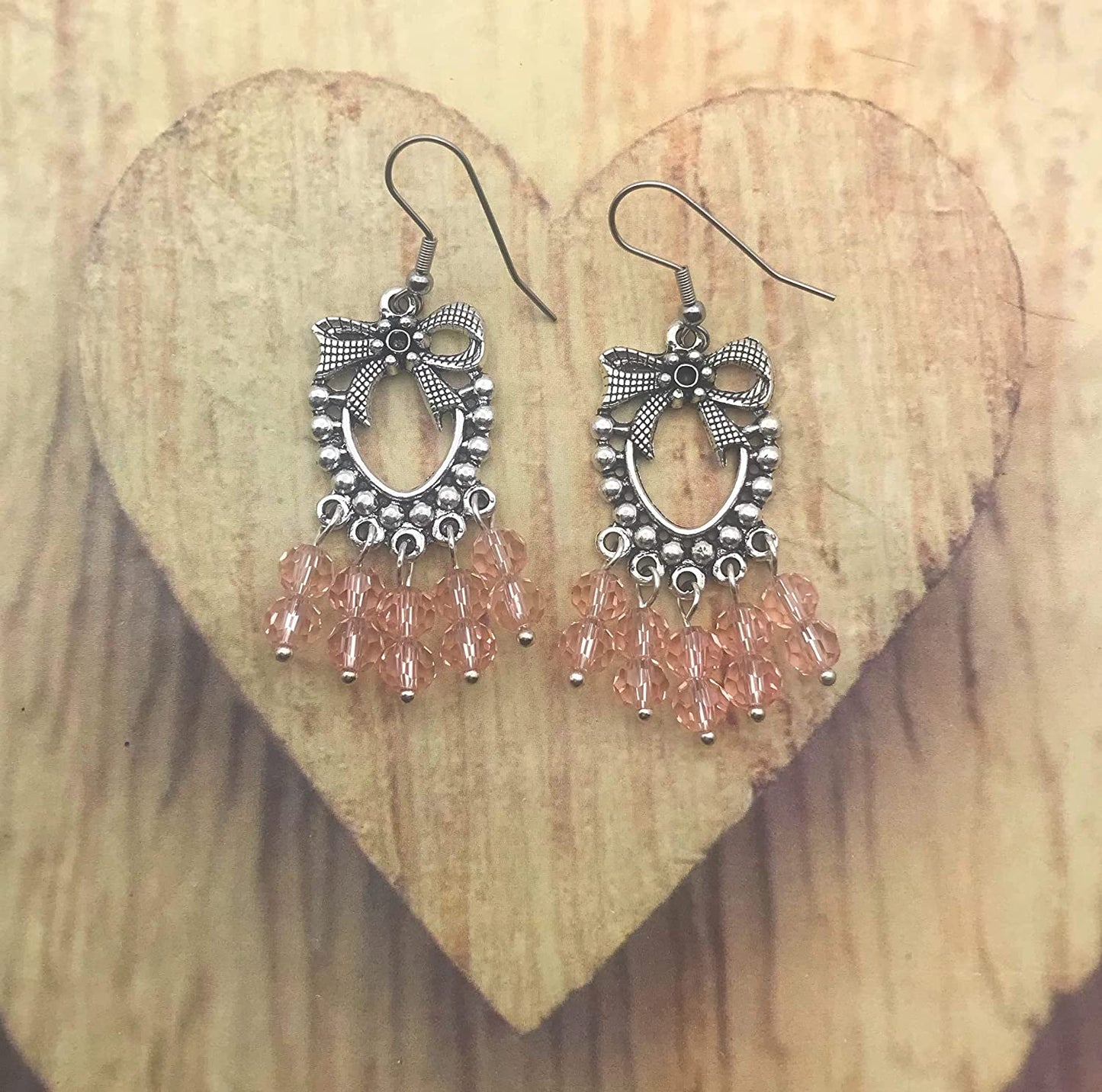 Pink Beaded Chandelier Earrings on a Wooden Display from Scott D Jewelry Designs