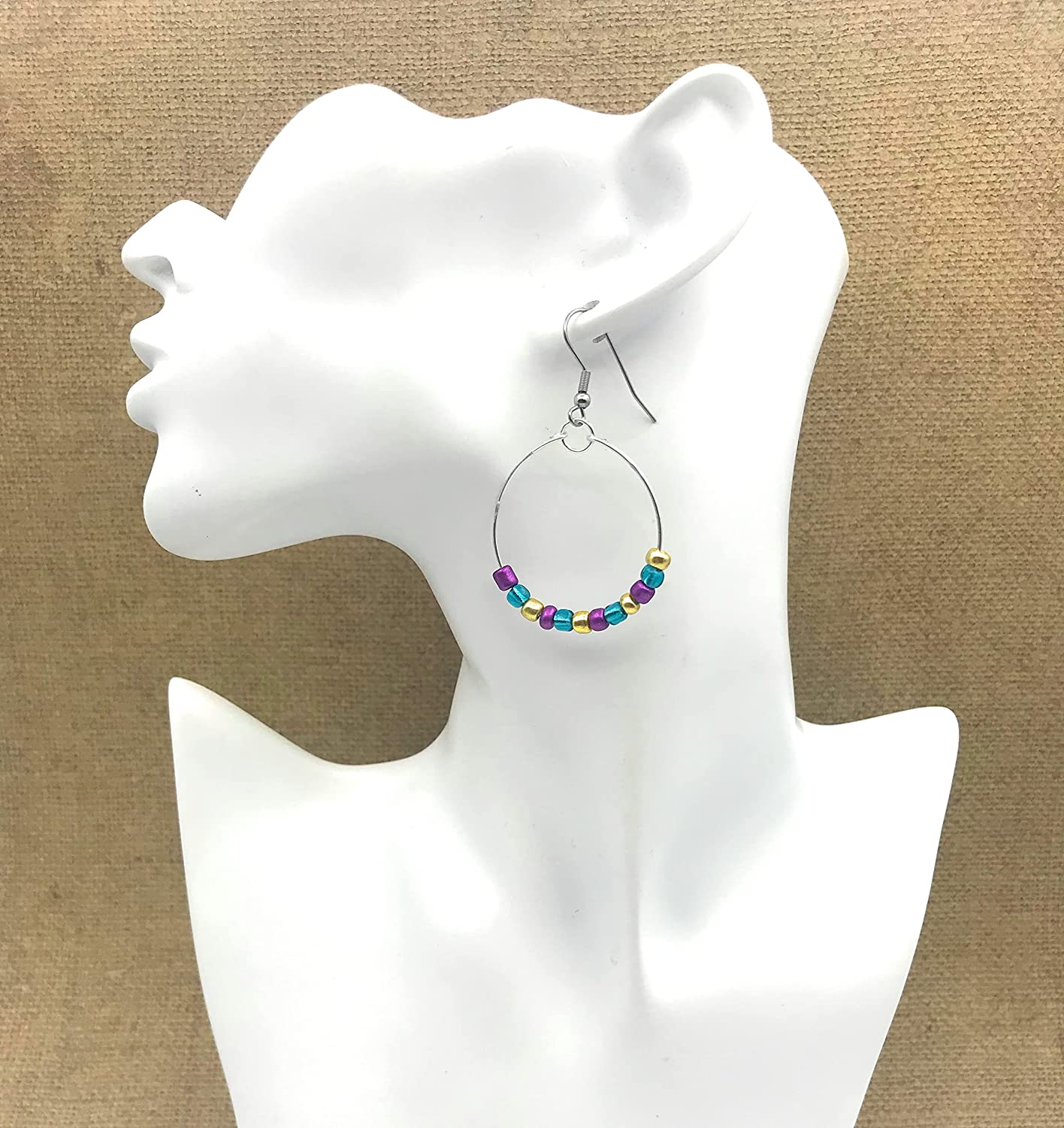 Mardi Gras Beaded Hoop Earrings displayed on mannequin from Scott D Jewelry Designs