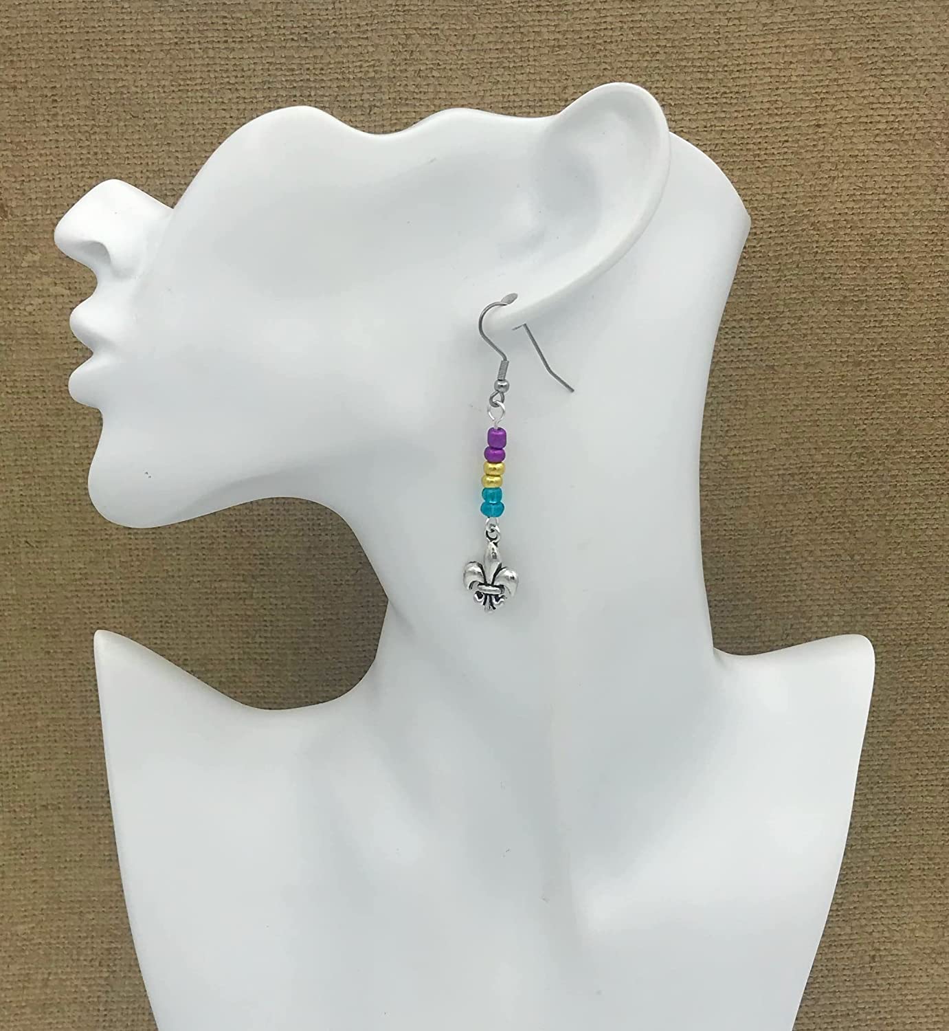 Mardi Gras Fleur De Lis Beaded Dangle Earrings Displayed on a Mannequin from Scott D Jewelry Designs