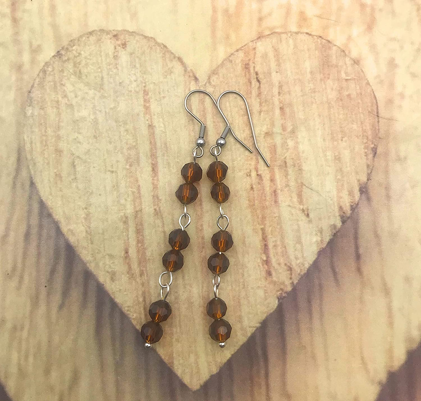 Brown Beaded Link Dangle Earrings on Wood Display by Scott D Jewelry Designs