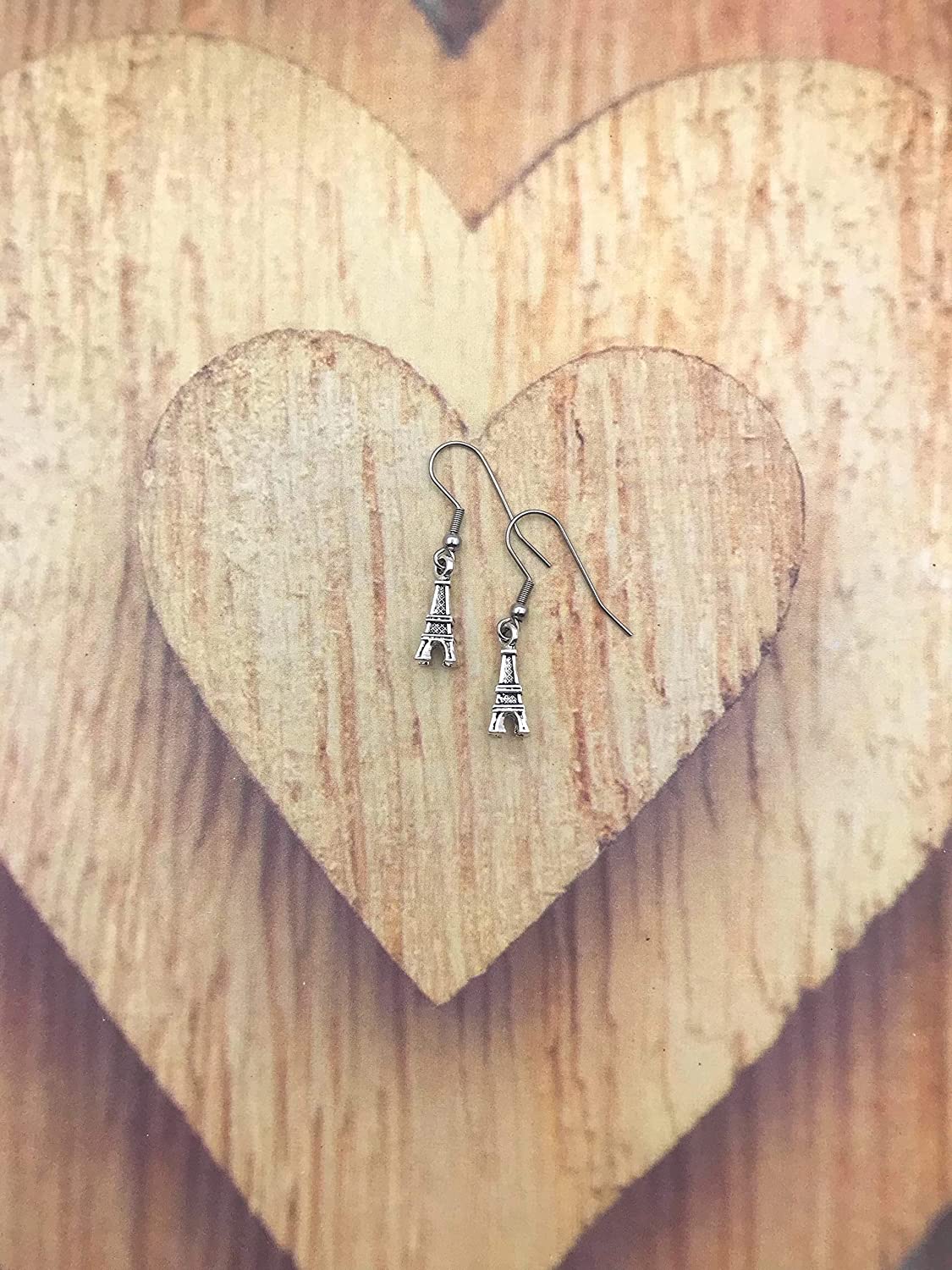 Small Antique Silver Eiffel Tower Earrings on Heart Shaped Wooden Display from Scott D Jewelry Designs