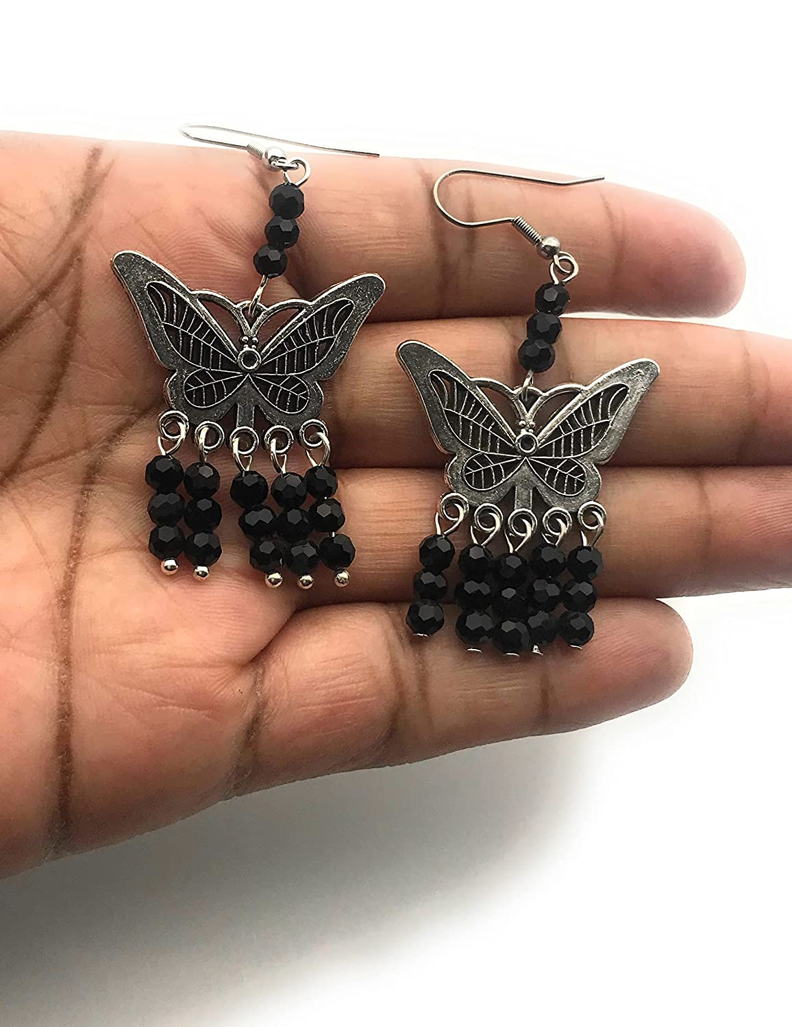Black Beaded Butterfly Chandelier Earrings in the Palm of a Hand at Scott D Jewelry Designs