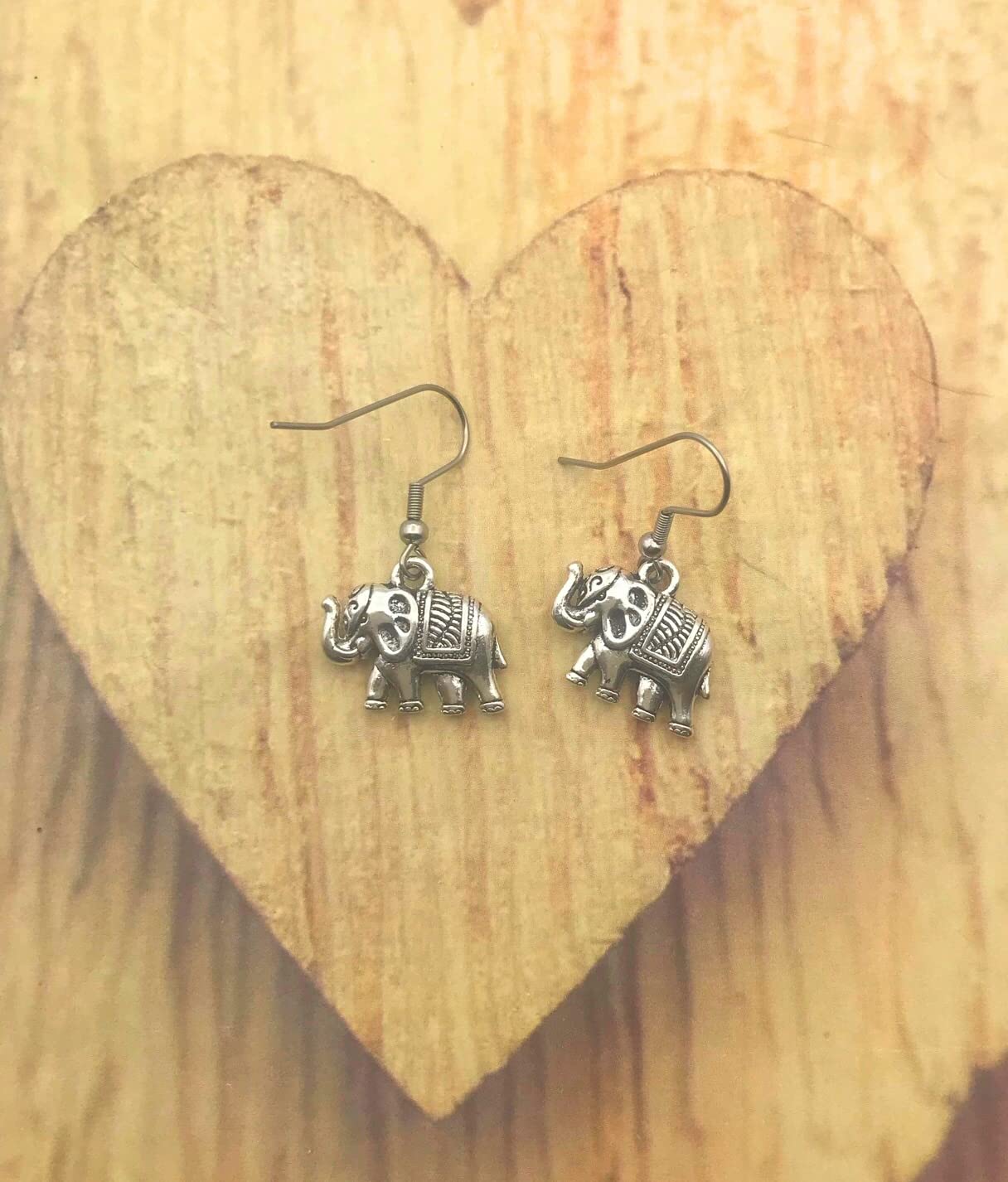 Silver Elephant Earrings on Wooden Display by Scott D Jewelry Designs